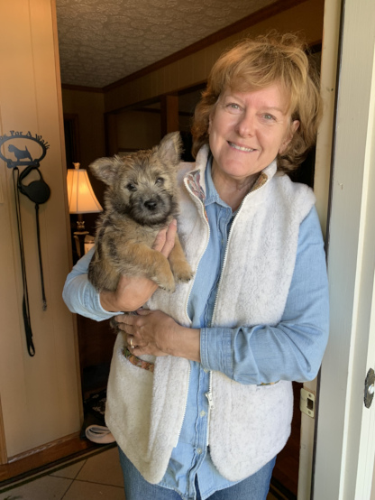 two tails up owner kim with her dog sitting on porch