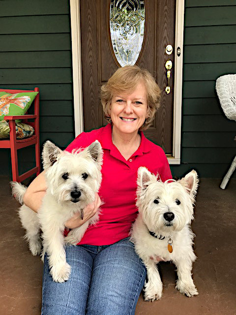 two tails up owner kim with her two dogs sitting on porch